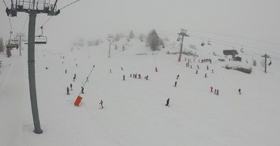 Brouillard, flocons et touristes
